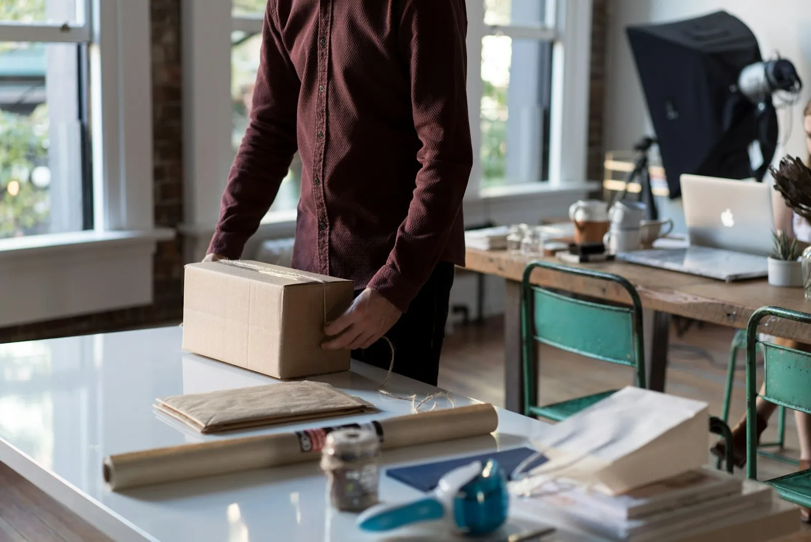 A packing desk with a carton being made up